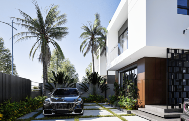 The front view of a white 2 bedroom townhouse for sale in Adent 2 cars parked at the front section of the house.